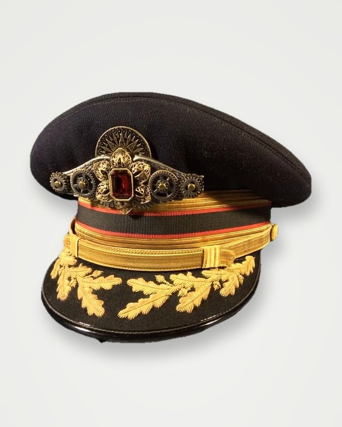 Black peak cap with gold bullion oak-leaf embroidery and badge